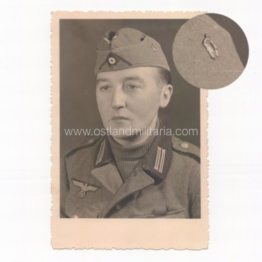 Photo of German Army soldier with unit pin (?) on sidecap Germany 1933–1945