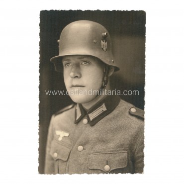 Photo of German Army soldier wearing an M16 helmet Germany 1933–1945