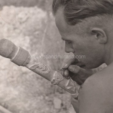 Photo of a German soldier carving Wolchow stick Germany 1933–1945